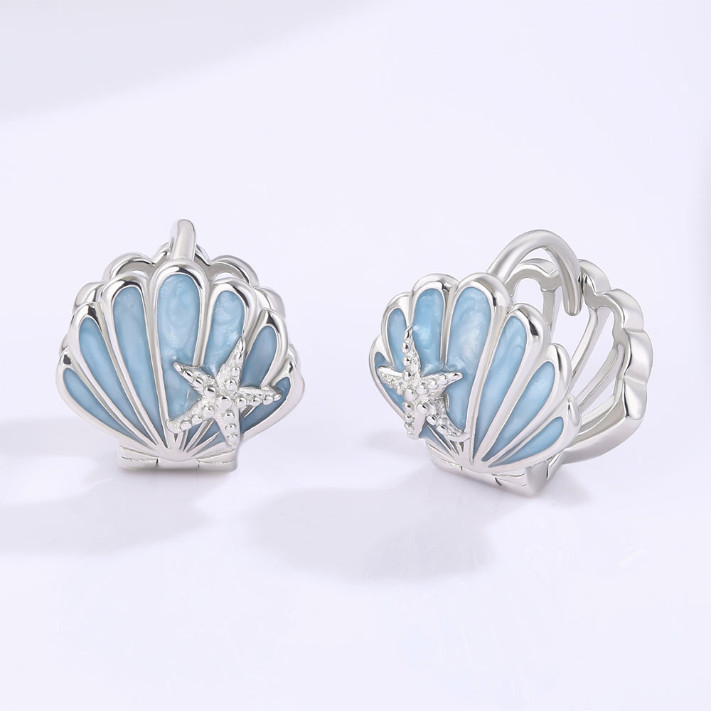 Ohrringe aus goldplattierter Legierung mit blauem Emporia®-Kristall