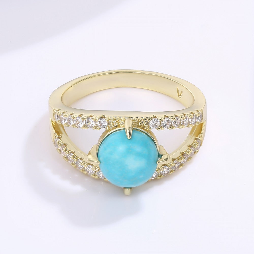 Ring aus goldplattierterr Legierung mit blauem Emporia®-Kristall