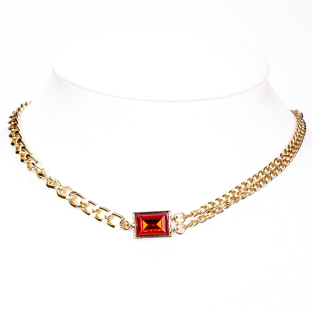 Uhr aus goldplattierter Legierung mit rotem Emporia®-Kristall und weißem Emporia® Kristall