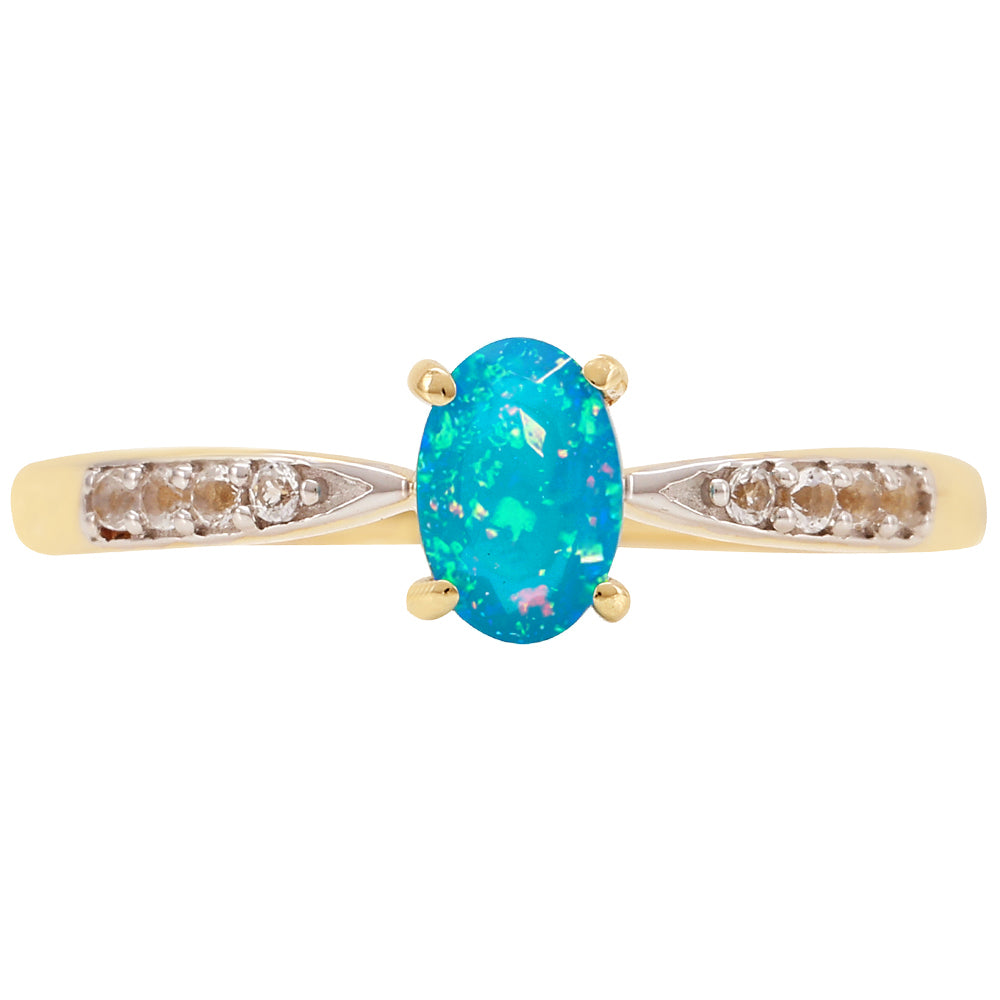 Goldring mit äthiopischem Paraiba-Blauopal und weißem Topas