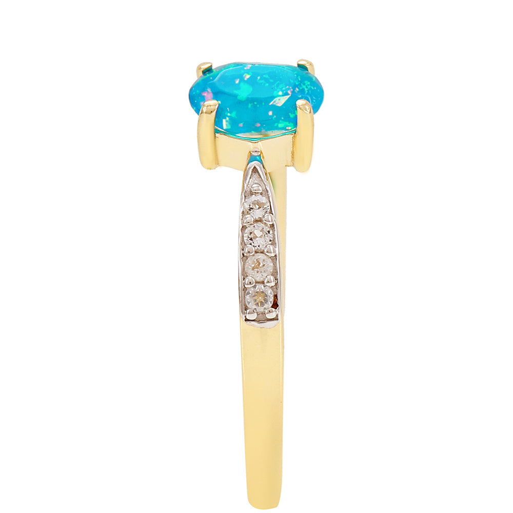 Goldring mit äthiopischem Paraiba-Blauopal und weißem Topas