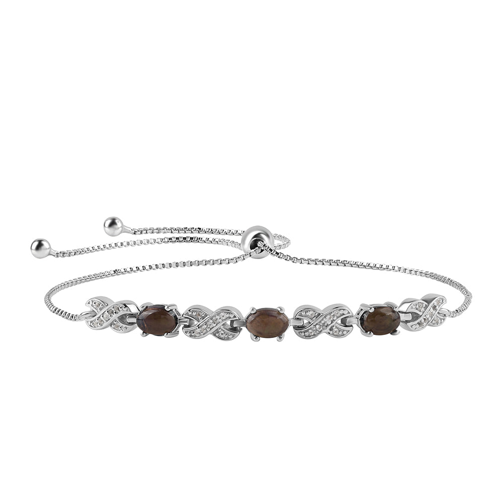 Silberarmband mit mitternachtsschwarzem äthiopischen Opal aus Lega Dembi und weißem Topas