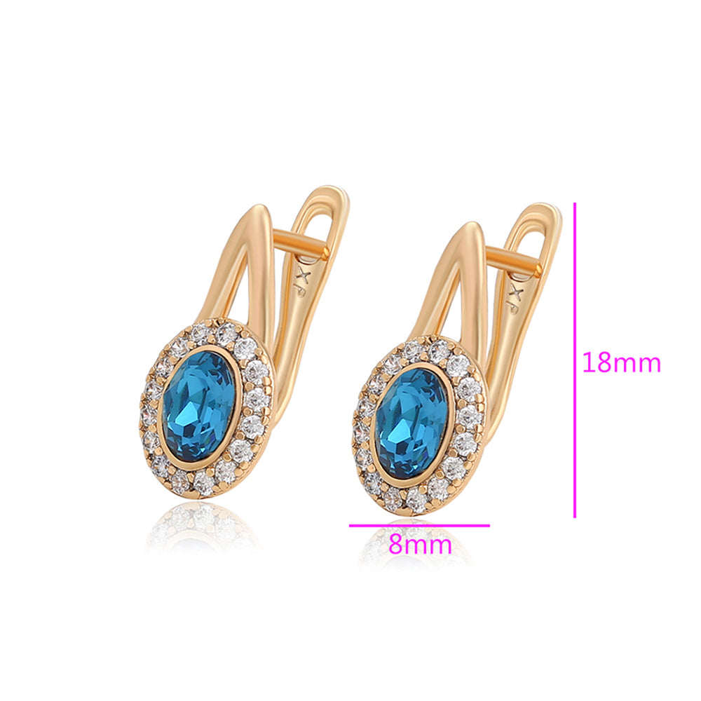 Ohrringe aus goldplattierter Legierung mit blauem Emporia®-Kristall und weißem Emporia® Kristall