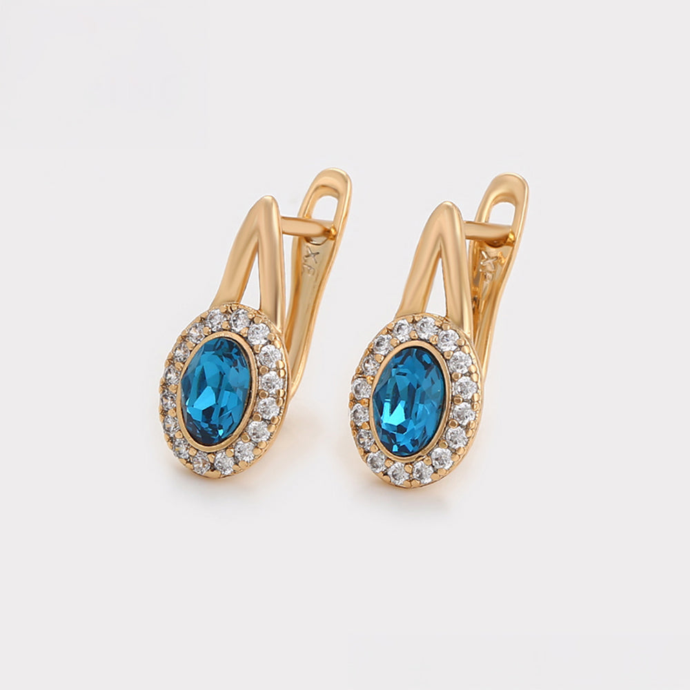 Ohrringe aus goldplattierter Legierung mit blauem Emporia®-Kristall und weißem Emporia® Kristall
