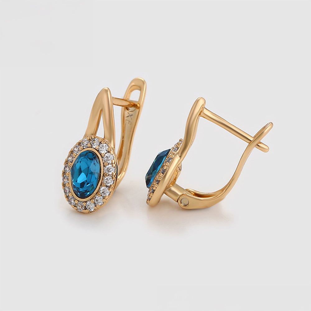 Ohrringe aus goldplattierter Legierung mit blauem Emporia®-Kristall und weißem Emporia® Kristall