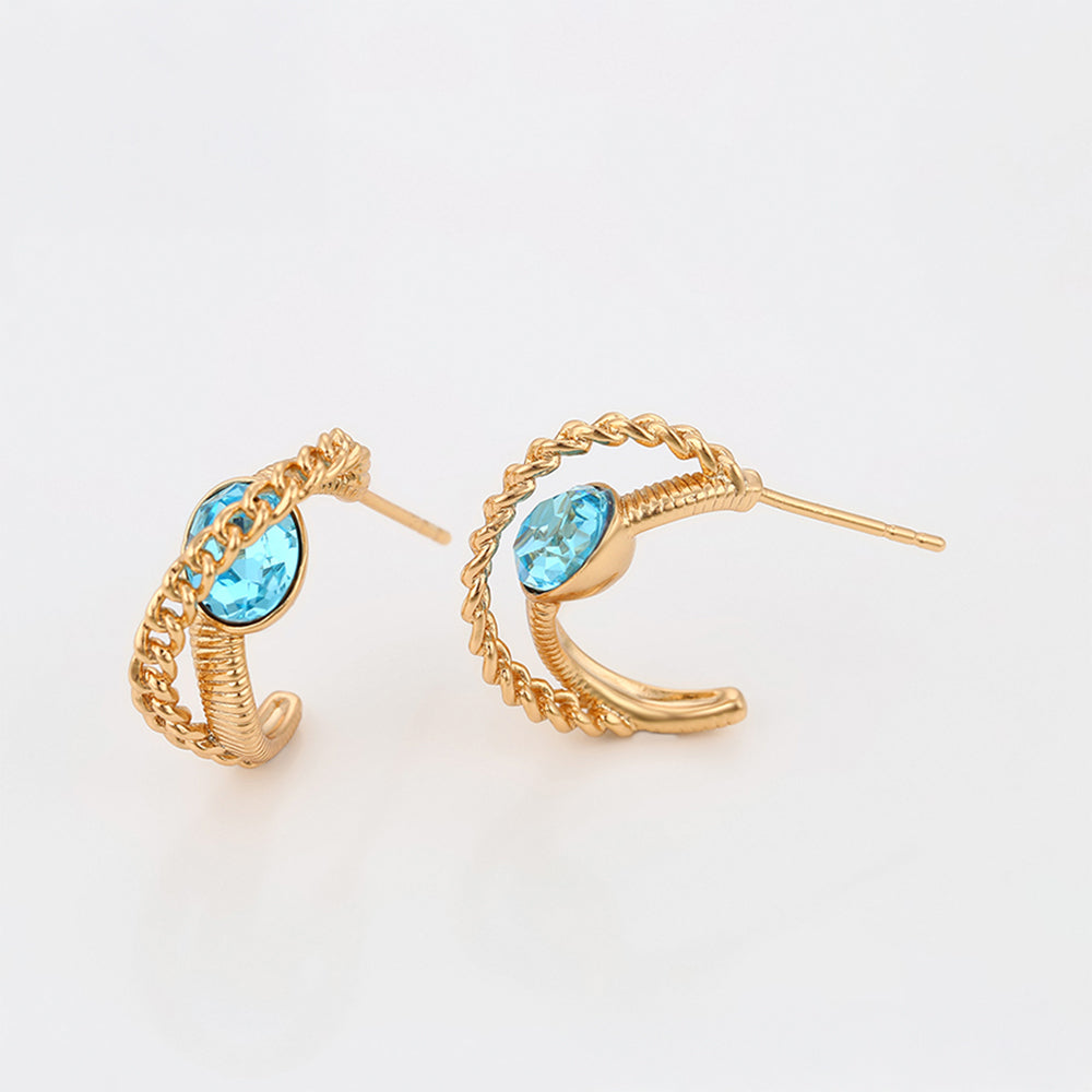 Ohrringe aus goldplattierter Legierung mit blauem Emporia®-Kristall