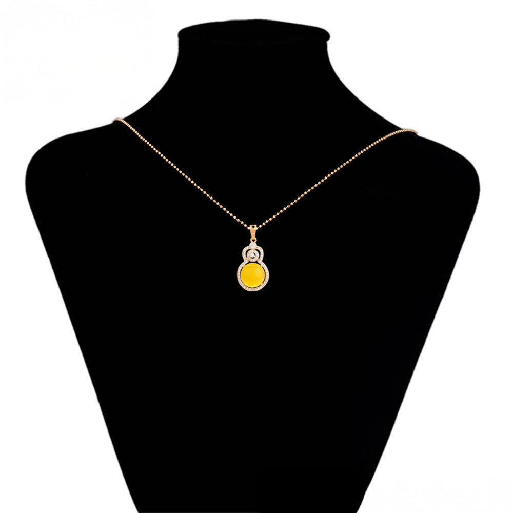Anhänger aus goldplattierterr Legierung mit gelbem Emporia®-Kristall und weißem Emporia® Kristall