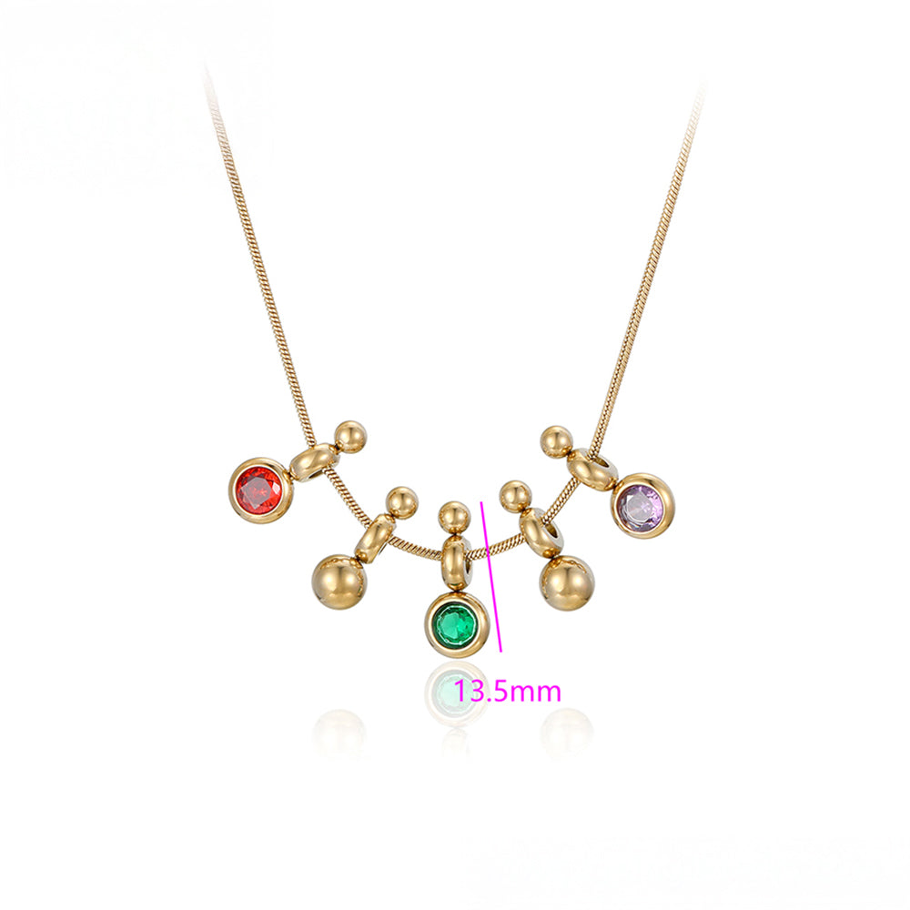 Halskette aus goldplattierter Legierung mit grünem Emporia® Kristall und rotem Emporia®-Kristall