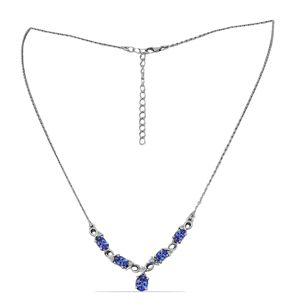 Silberhalskette mit Tansanit und weißem Topas