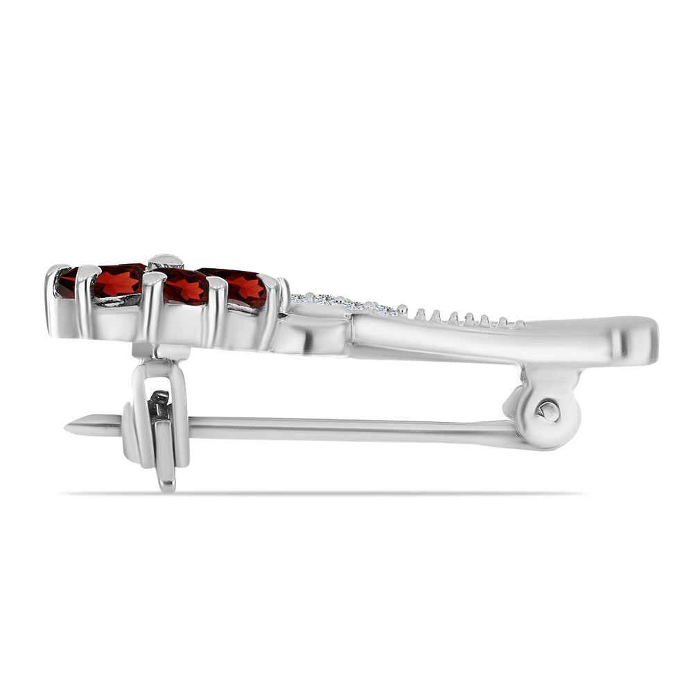 Silberbrosche mit Barton Granat und weißem Topas