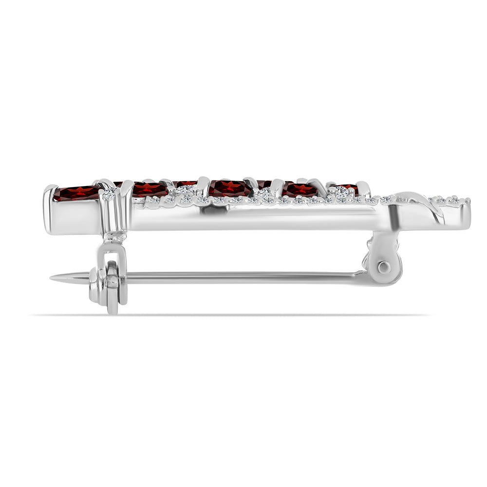 Silberbrosche mit Barton Granat und weißem Topas