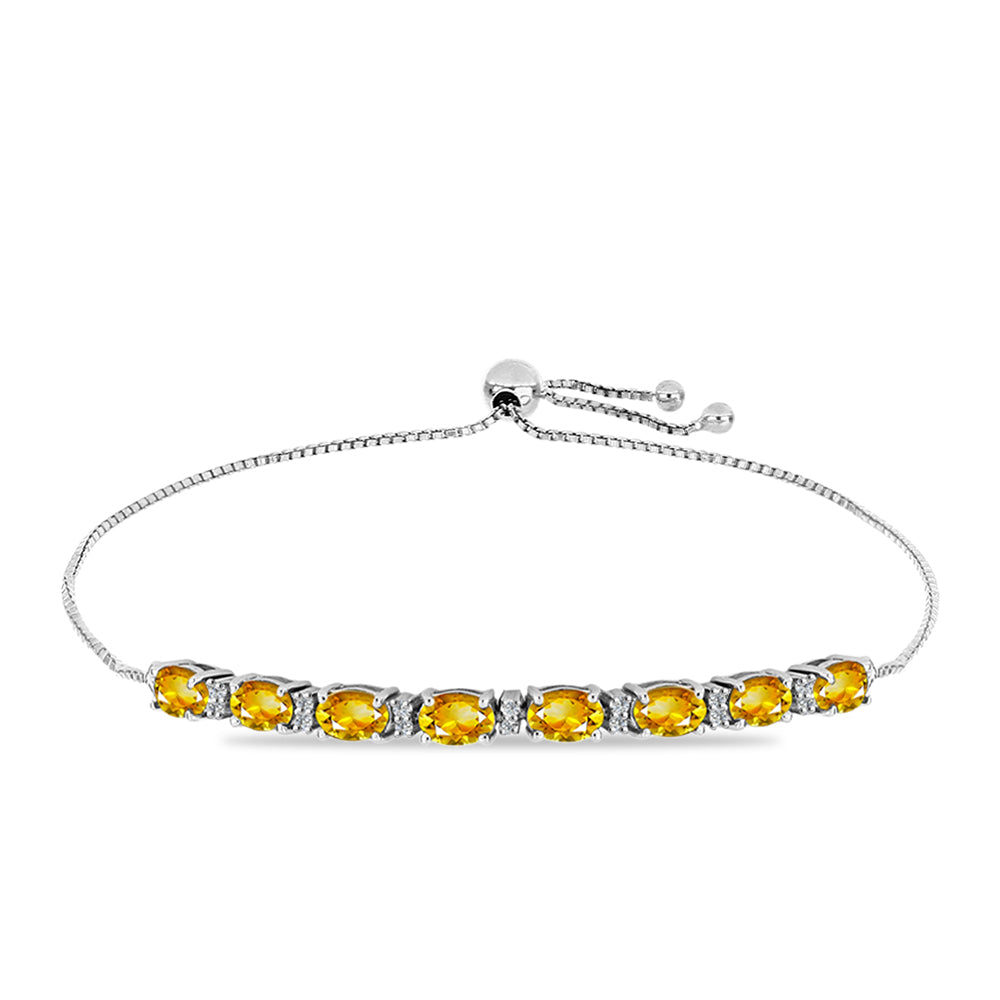 Silberarmband mit goldfarbenem Rio Zitrin und weißem Topas