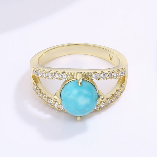 Ring aus goldplattierterr Legierung mit blauem Emporia®-Kristall