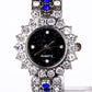 Uhr aus goldplattierter Legierung mit blauem Emporia®-Kristall