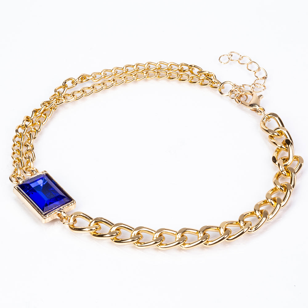 Uhr aus goldplattierter Legierung mit blauem Emporia®-Kristall und weißem Emporia® Kristall