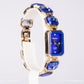 Uhr aus goldplattierter Legierung mit blauem Emporia®-Kristall