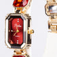 Uhr aus goldplattierter Legierung mit rotem Emporia®-Kristall