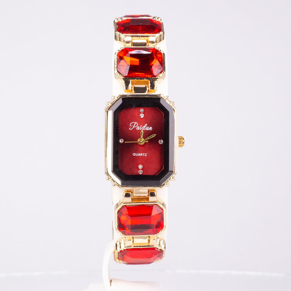 Uhr aus goldplattierter Legierung mit rotem Emporia®-Kristall
