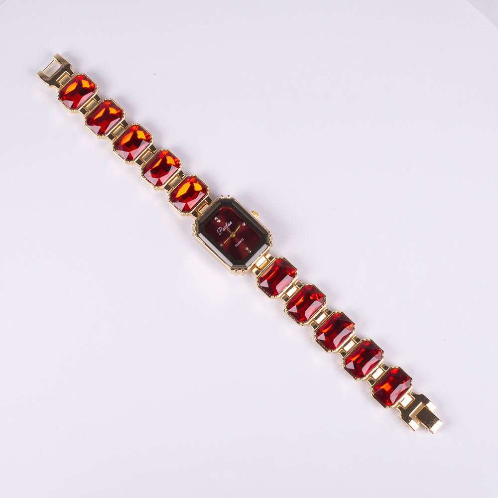 Uhr aus goldplattierter Legierung mit rotem Emporia®-Kristall 5 