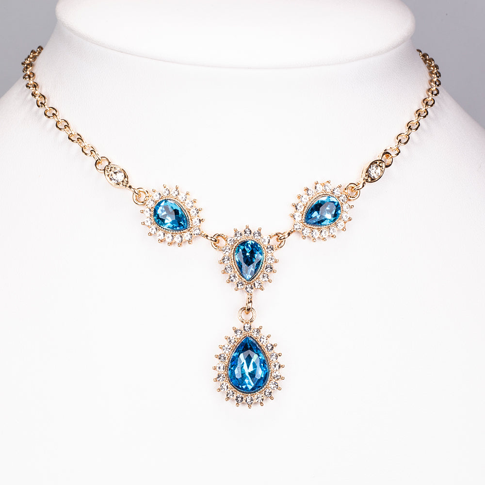 Schmuckgarnitur aus aus goldplattierter Legierung mit blauem Emporia®-Kristall und weißem Emporia® Kristall 3 