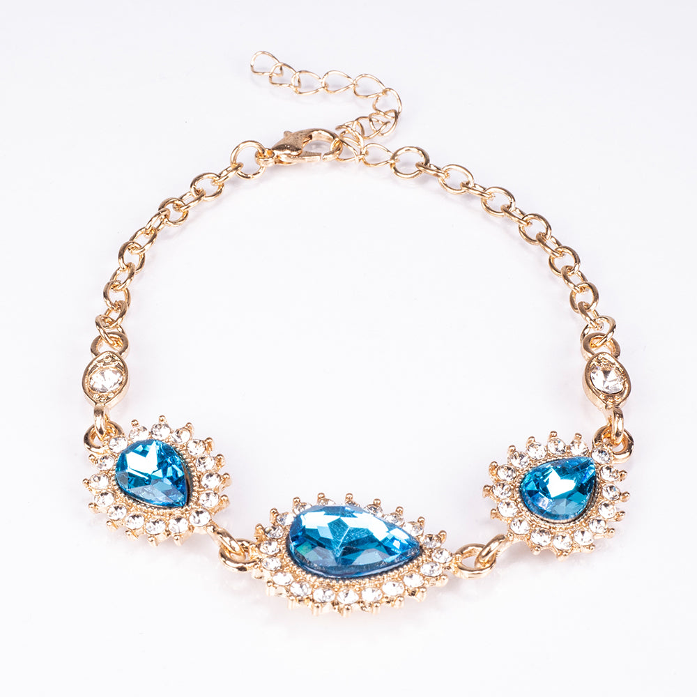 Schmuckgarnitur aus aus goldplattierter Legierung mit blauem Emporia®-Kristall und weißem Emporia® Kristall