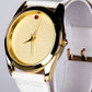 Uhr aus goldplattierter Legierung mit Rubin