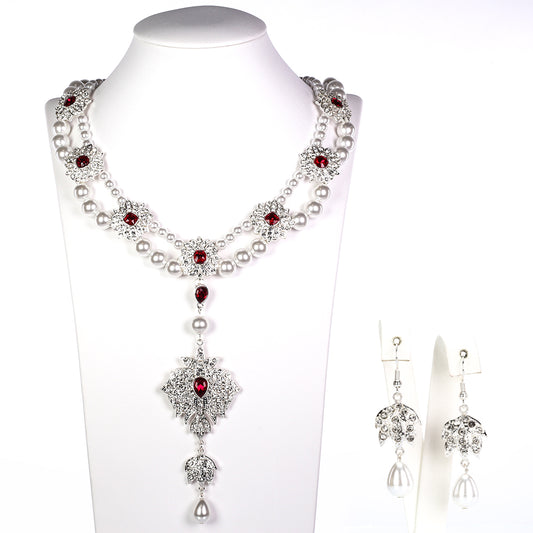 Schmuckgarnitur aus aus goldplattierter Legierung mit Glasperle und weißem Emporia® Kristall