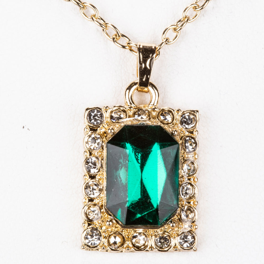 Uhr aus goldplattierter Legierung mit grünem Emporia® Kristall und weißem Emporia® Kristall