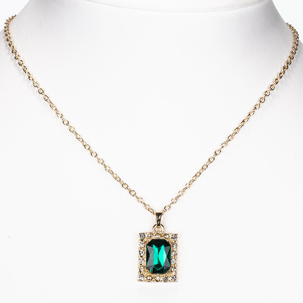 Uhr aus goldplattierter Legierung mit grünem Emporia® Kristall und weißem Emporia® Kristall