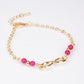 Armband aus goldplattiertesr Legierung mit Rubin