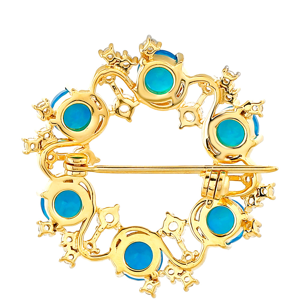 Goldplattierte Silberbrosche mit äthiopischem Paraiba-Blauopal und weißem Topas