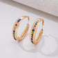 Ohrringe aus goldplattierter Legierung mit rotem Emporia®-Kristall und blauem Emporia®-Kristall