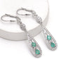 Silberohrringe mit brasilianischem Smaragd und weißem Topas