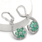 Silberohrringe mit brasilianischem Smaragd und weißem Topas