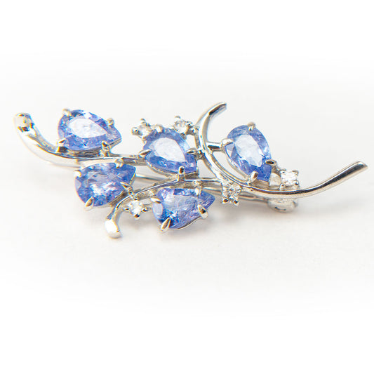 Silberbrosche mit Tansanit - Klasse AAA und weißem Topas