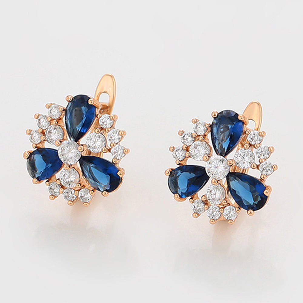 Ohrringe aus goldplattierter Legierung mit blauem Emporia®-Kristall und weißem Emporia® Kristall