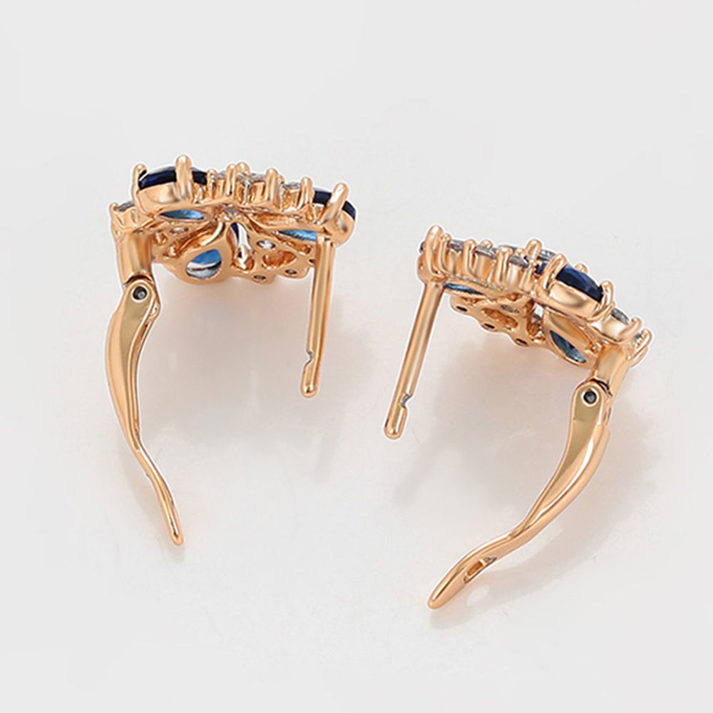 Ohrringe aus goldplattierter Legierung mit blauem Emporia®-Kristall und weißem Emporia® Kristall