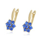 Ohrringe aus goldplattierter Legierung mit blauem Emporia®-Kristall