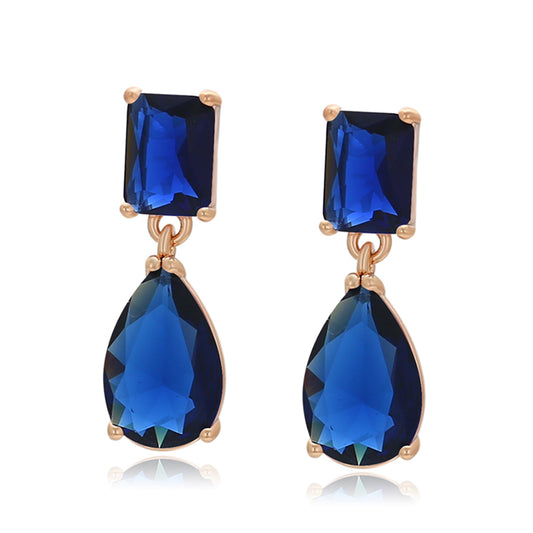 Ohrringe aus goldplattierter Legierung mit blauem Emporia®-Kristall