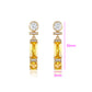 Ohrringe aus goldplattierter Legierung mit gelbem Emporia®-Kristall und weißem Emporia® Kristall