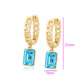 Ohrringe aus goldplattierter Legierung mit blauem Emporia®-Kristall
