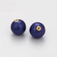 Talisman aus goldplattierter Legierung mit blauem Emporia®-Kristall