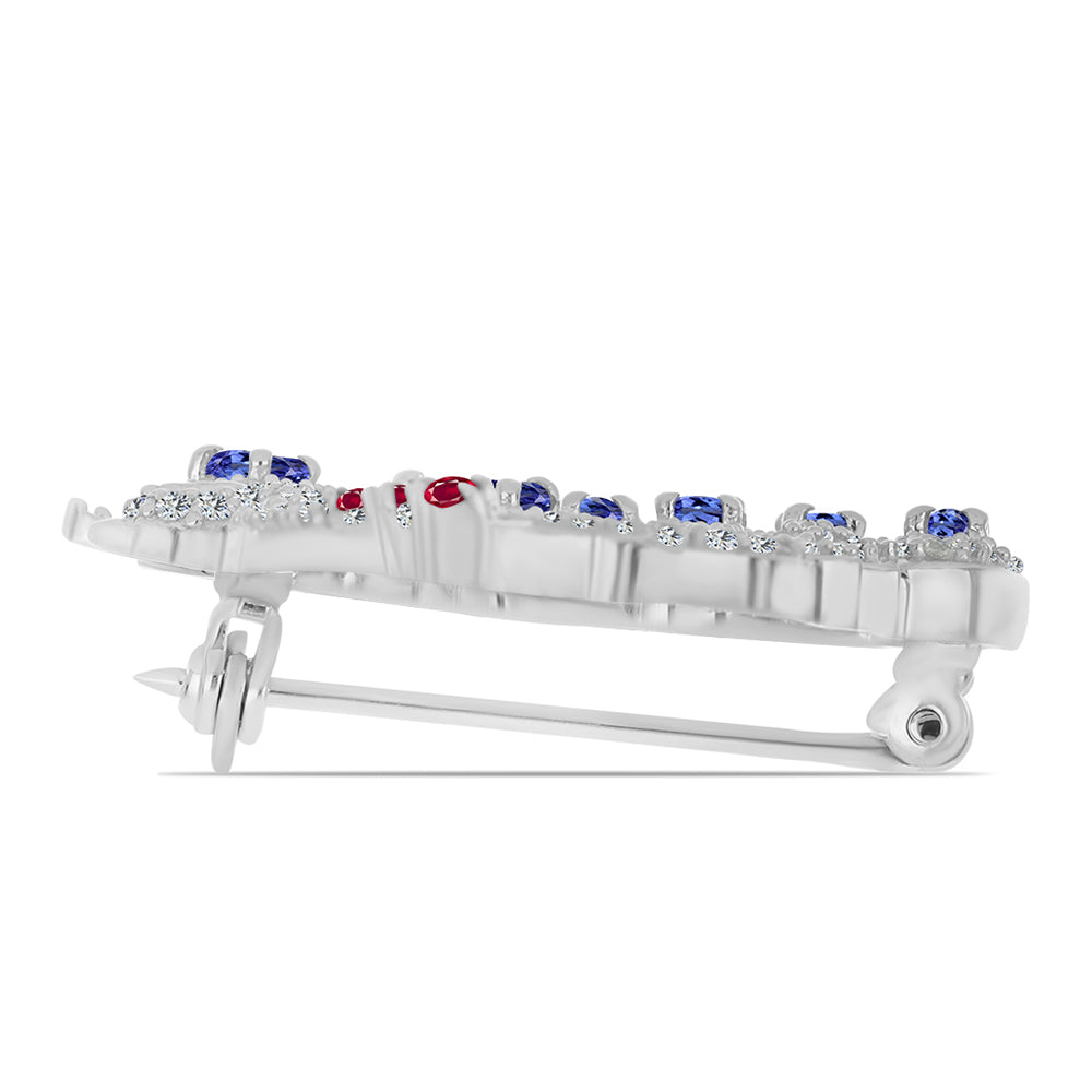 Silberbrosche mit Tansanit und Rubin aus Madagaskar