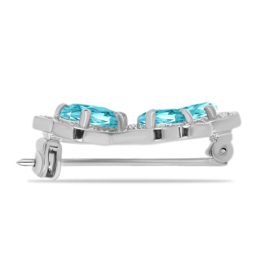 Silberbrosche mit Paraiba Quarz und weißem Topas