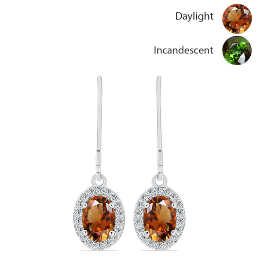 Silberohrringe mit zertifiziertem laborgezüchteten Zultanit aus Anatolien und weißem Topas