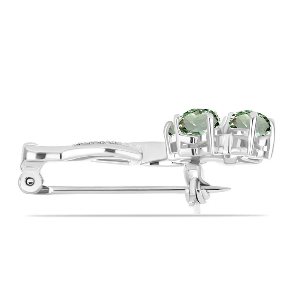 Silberbrosche mit grünem Amethyst und weißem Topas