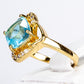 Ring aus goldplattierterr Legierung mit blauem Emporia®-Kristall