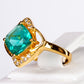Ring aus goldplattierterr Legierung mit grünem Emporia® Kristall
