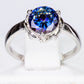 Ring aus goldplattierterr Legierung mit blauem Emporia®-Kristall