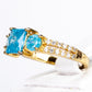 Ring aus goldplattierterr Legierung mit blauem Emporia®-Kristall und weißem Emporia® Kristall